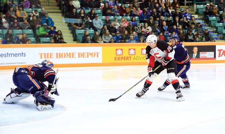 Prince George Cougars Kody McDonald skates in on a breakaway against Kamloops Blazers Dylan Ferguson on Saturday at CN Centre. The Blazers were in town to take on the Cougars in the second game of a weekend doubleheader. Citizen Photo by James Doyle January 23, 2016