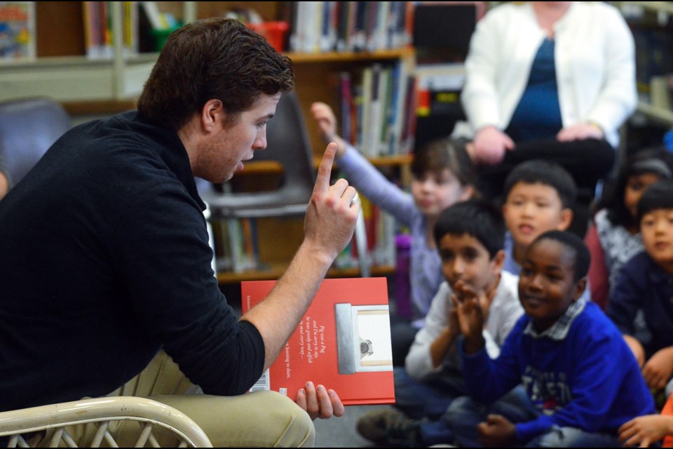Vancouver Canucks rookie Ben Hutton talks about his fist NHL goal with Edmonds Community School students Monday.