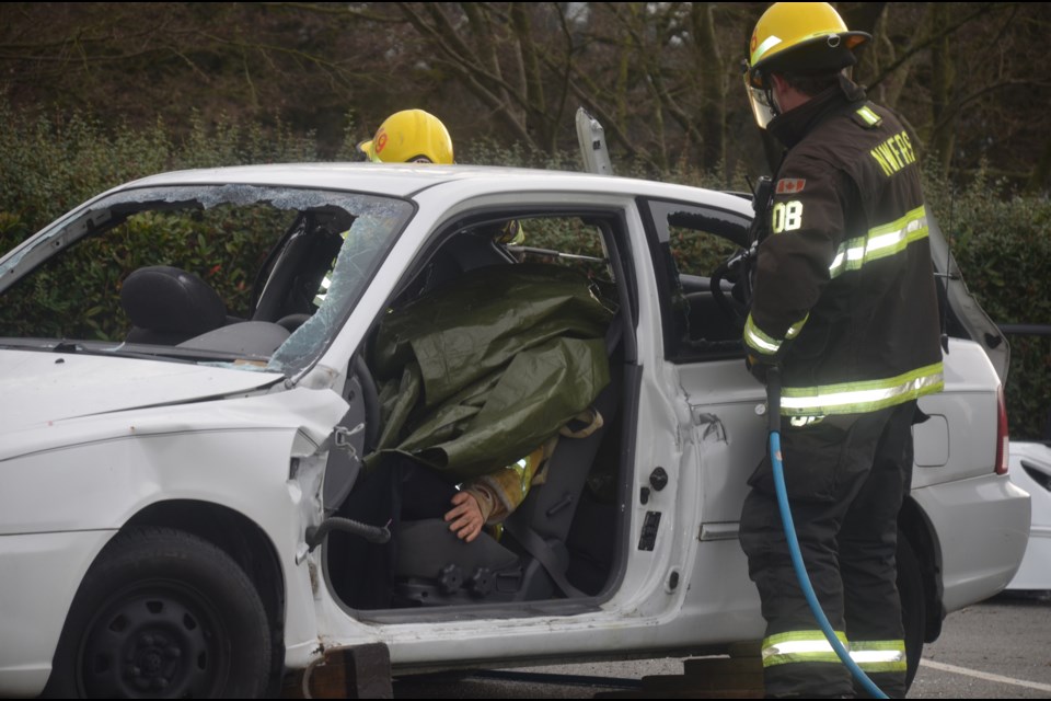 New Westminster firefighters used the Jaws of Life during an auto extrication demonstration aimed at promoting this year's youth firefighter program.