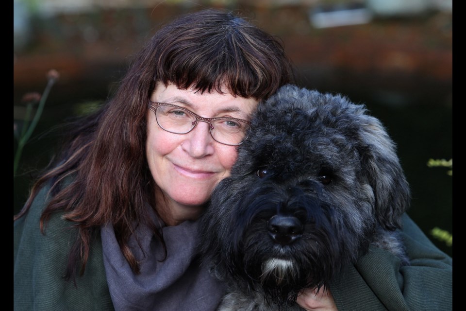 Capital5 Frances von Aesch cuddles Henk, a six-month-old Bouvier. A vet bill for $2,000 &Ograve;was worth it&Oacute; as many pet owners consider their furry friends members of the family.