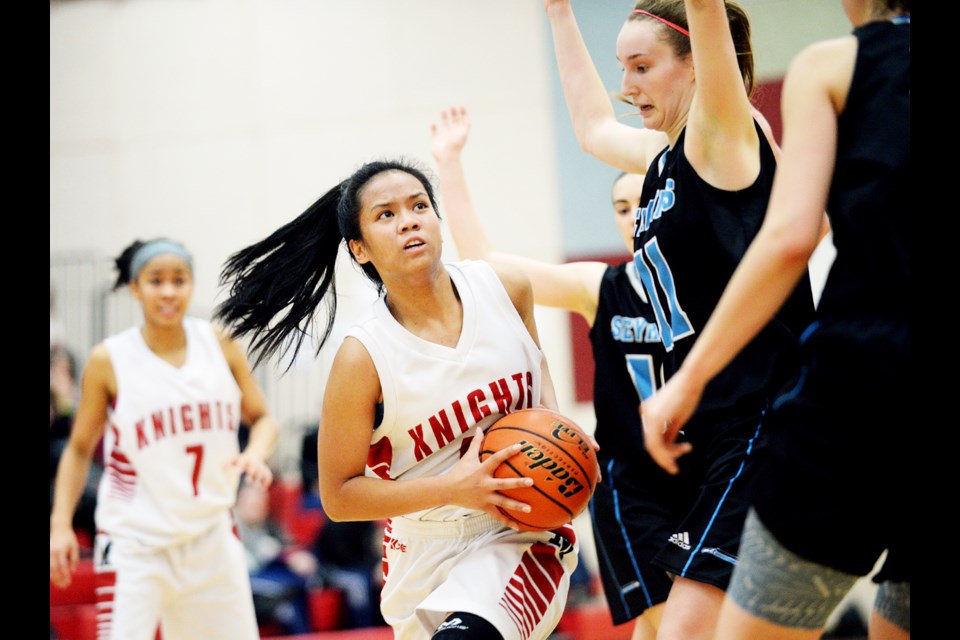 St. Thomas More's Gabrielle Laguerta looks for an opening during Saturday's championship final against Seycove. The Knights would prevail and cart off the senior girls Chancellor tourney title.