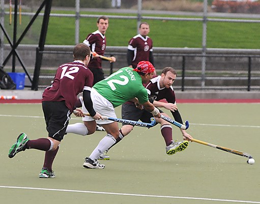 West Vancouver FHC (purple) in action against Surrey Lions during Vancouver Field Hockey League Senior Men's A division final at Rutledge Field.
