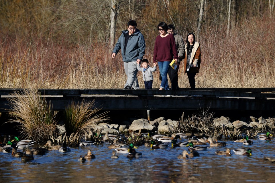 Frank, Maggie and 14-month old Neal Xiao at Burnaby Lake on Family Day.