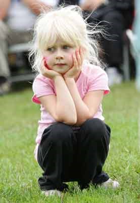 Three-year-old Kimberley Underwood watches performances on stage during the North Vancouver celebration of Canada Day at Waterfront Park, Sunday July 1st.