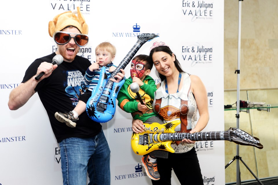 Ariana Halouakos and Jackson, Kane and Ryan Bloomfield pose in the Photo Booth during Family Day fun at the Anvil Centre.