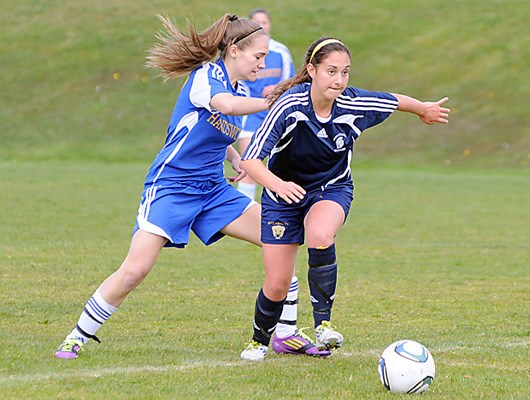 Handsworth (light blue) and Sentinel (dark blue) in senior girls high school soccer action at Boulevard Park in North Vancouver.