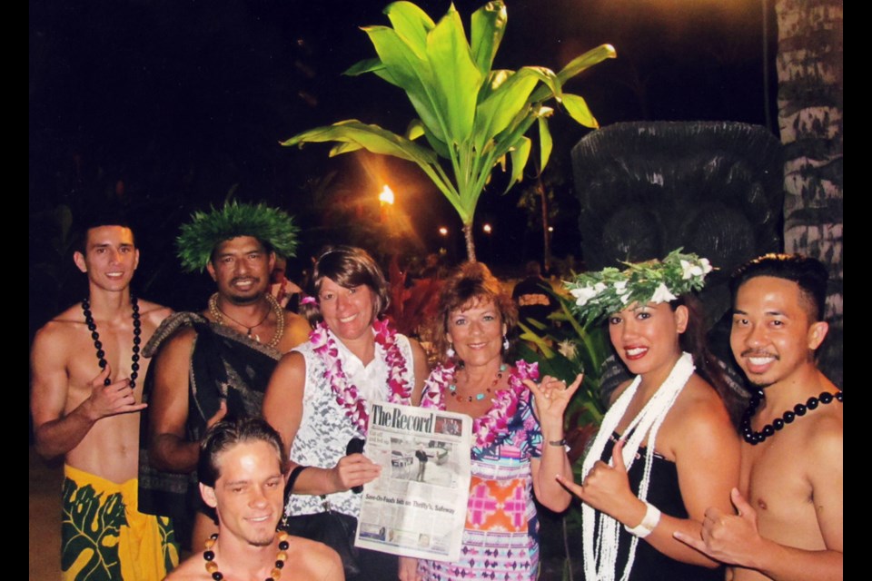 Longtime New West resident Frankie McKay (in pink) and her friend Shelly Balas posed with the hula men at a luau in the historic town of Lahaina in West Maui.