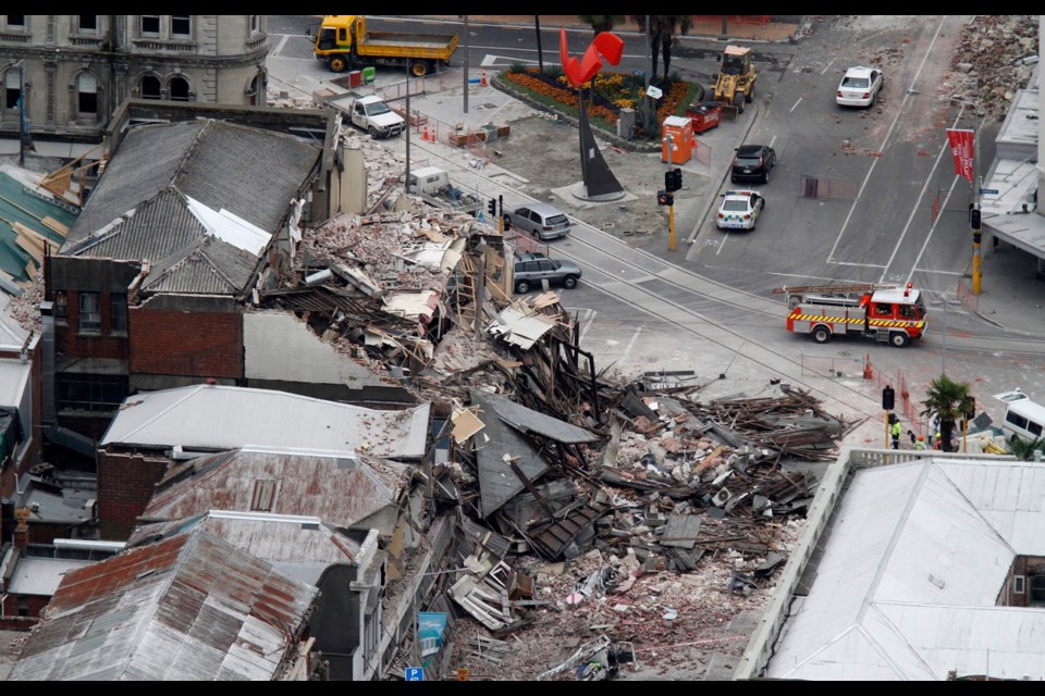 Rescue workers block off a collapsed building in central Christchurch, New Zealand, on Feb. 22, 2011, following a magnitude-6.3 earthquake.