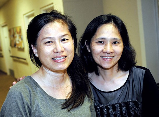 Yu Wen Chen and Jennifer Ko greet guests.