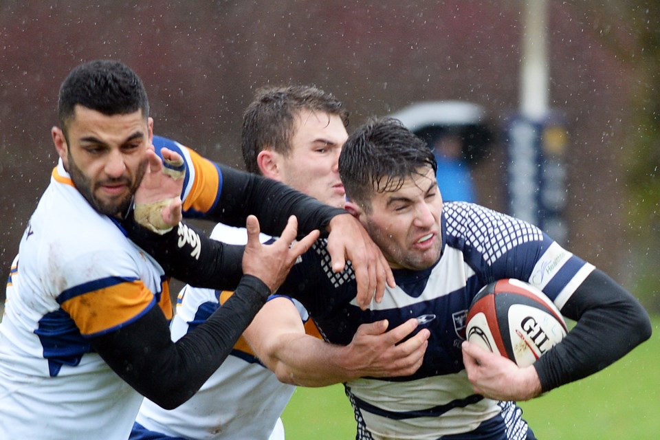 Burnaby Lake’s Gareth Marsden, at right, attempts to pull away from UBC’s Manar Kulkhan, left, during their men’s premier spring league encounter on Saturday at Burnaby Lake.