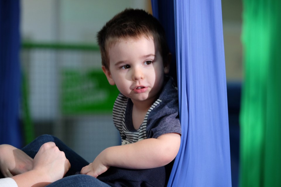 Harrison Pike tries out the aerial silks during a circus drop-in at River Market last year. Vancouver Circus School's River Market location has two regular drop-ins for the preschool crowd.
