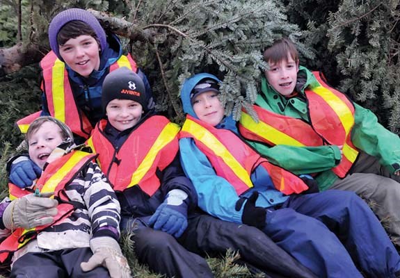 Simon Brown (left), Ethan Edwardsen, Graeme Halliday-Gunn, Kyle McInnis and Jeffery Austen of the 30th Seymour Scouts take a break during their annual Christmas tree chip held in Lynn Valley.