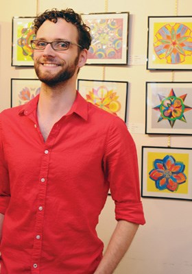 Gallery volunteer Steven Snider greets guests.