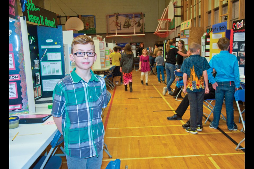 Grade 5 Charlie Lake Elementary student Mason Maddigan successfully extracted iron from a variety of breakfast cereals for his science fair project. Maddigan was one of 131 students who presented their projects at the school's science fair Tuesday.