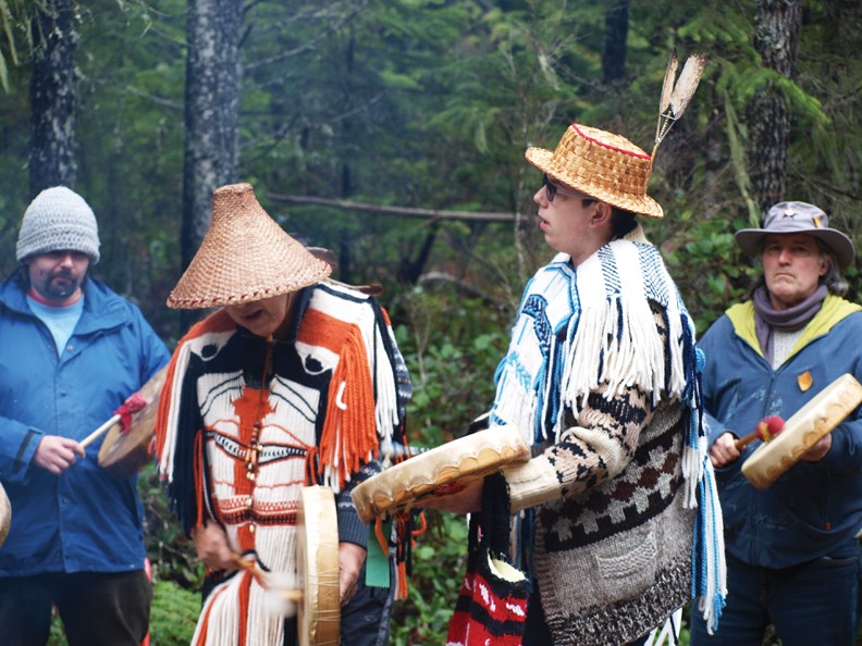 ELF supporters join Sechelt Indian Band members in singing and drumming at the blockade.