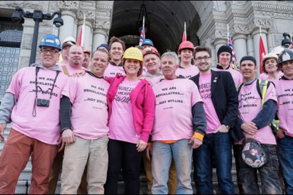 Bricklayers with Rob Tournour Masonry joined Premier Christy Clark on the steps of the legislature to support Pink Shirt Day.