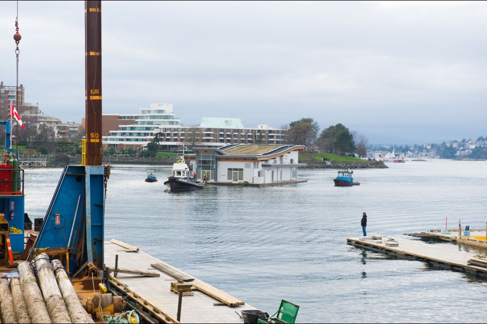 A new floating seaplane terminal is towed into place at Victoria's Inner Harbour on Saturday, Feb. 27, 2016.
