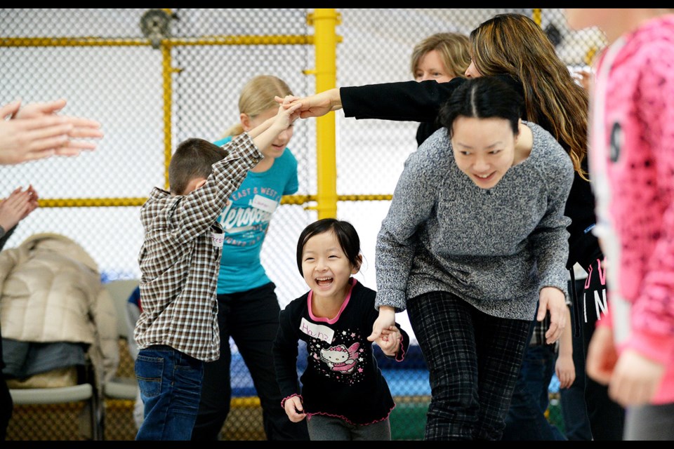 Hanzi Yang, 5, gets into the spirit of square dancing during a workshop at River Market on Sunday, Feb. 28.