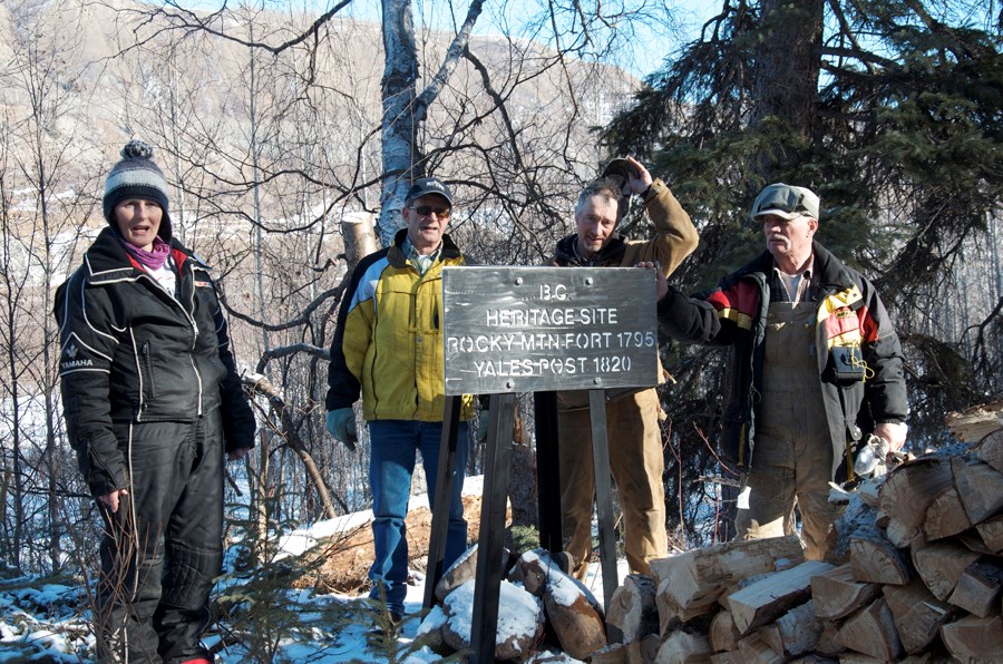 Arlene Boon, Bob Fedderly, Ken Boon and Mark Meiers stand by a sign that marks the historical Rocky Mountain Fort site.