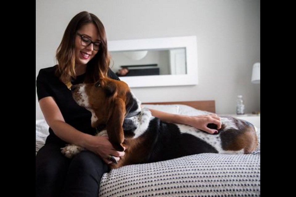 Carly Bright with her dog, Dean, at their Toronto home. The floppy-eared basset hound has more than 107,000 Instagram fans through #DogsOfInstagram, where rising canine stars can score anything from free doggie treats to lucrative book deals.
