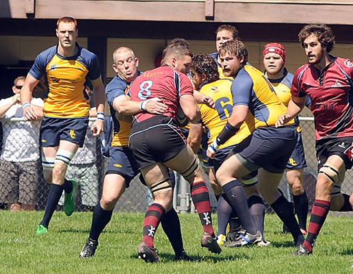 BC Bears player takes down Rock player (red).