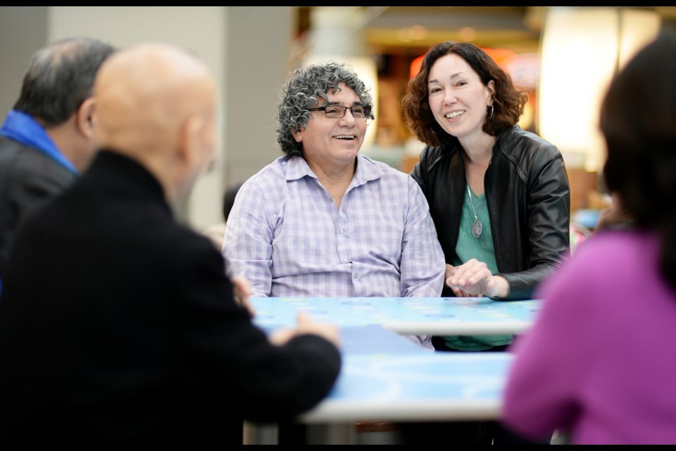 Lidio Baldeon and Mona Donovan of Mona’s Club, a group of immigrant seniors that meet once a month in the Metrotown food court.
