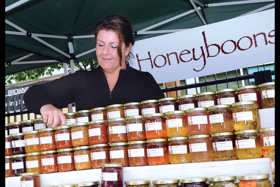 NEWS photo Paul McGrath
Carrie Lazareff stacks fresh-baked focaccia bread at the Lynn Valley Green Market.