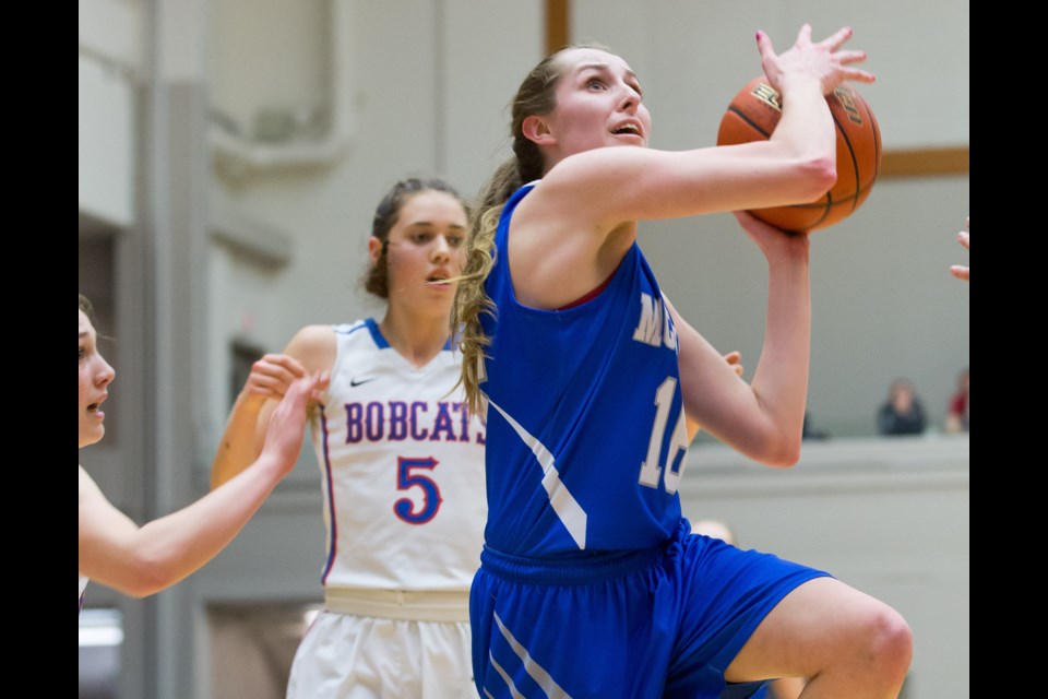 McMath's Bobbi-Jo Colburn drives to the basket during Saturday's B.C. AAA championship game at the Langley Events Centre. The Wildcats saw their memorable season end with a 73-50 loss to three-time defending champion Brookswood.