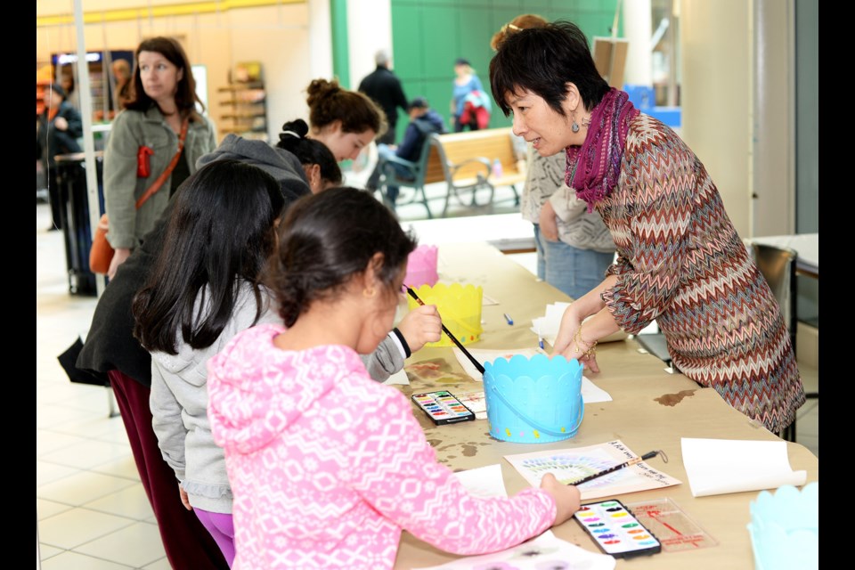 Artist Ming Yeung leads a freestyle Chinese painting workshop as part of the ArtsToGo series, held on Sunday, March 6 at Royal City Centre.