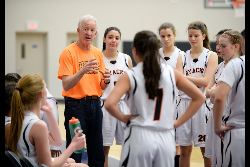 New Westminster Hyacks coach Doug Woodward discusses strategy during a timeout on Day 3 of the B.C. senior girls basketball championships in Langley.