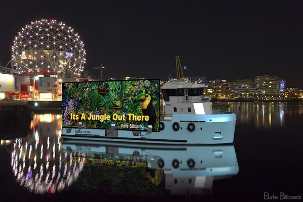 Burke Billboards's sign on a boat appeared in False Creek earlier this week. The boat has since been detained by Transport Canada. Photo Burke Billboards