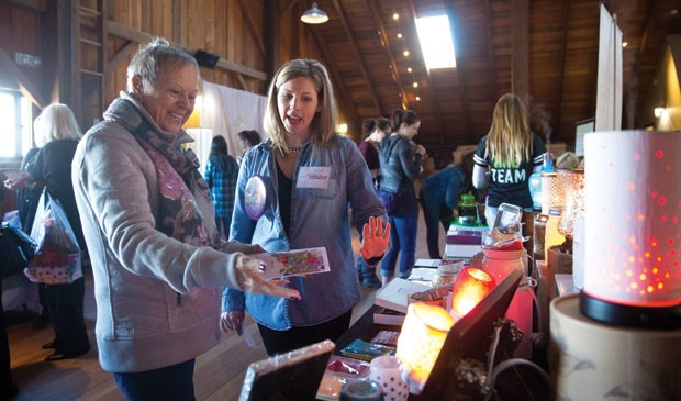 Fairy Tales Women’s Expo and Bridal Fair, a fundraiser for Tiny Tales Pony Rescue Society, took place earlier this month at Harris Barn in Ladner. Tricia Schaefer (above) explains her Scentsy wickless candles products to a customer.