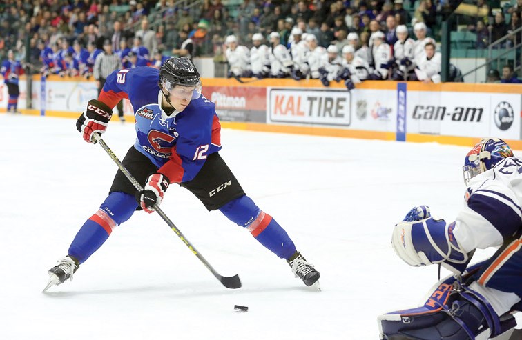 Prince George Cougars Jansen Harkins goes in on a breakaway against Kamloops Blazers Dylan Ferguson on Saturday at CN Centre. The Cougars and Blazers met in the final regular season game for both teams. Citizen Photo by James Doyle March 19, 2016