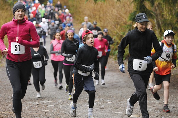 Racers stretch their legs in the wide-open start to My First Trail Race.