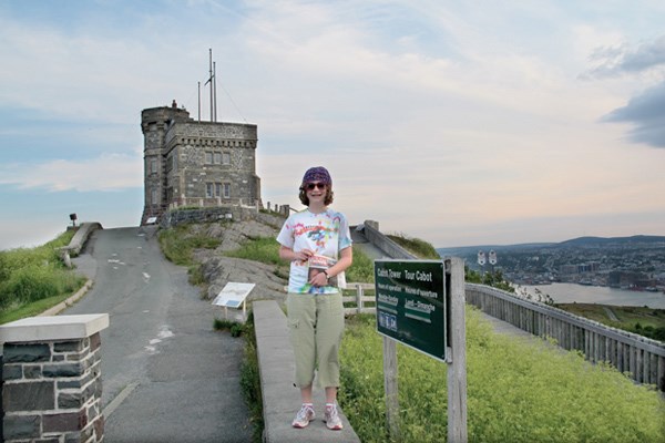 Heather Paynter takes the North Shore News to new heights atop Signal Hill on her way to visit Cabot Tower in St. John's in Newfoundland. The first trans-Atlantic wireless signal was received at this hill site, and it has a long maritime and military history in the area.