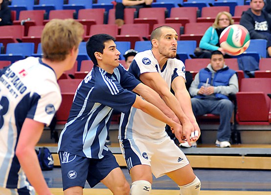 Capilano University men's Blues volleyball team in action against Camosun College Chargers.