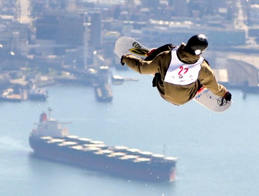 Snowboarder Jon Versteeg appears headed for the ocean after launching off a jump at the Quiksilver Showdown Over the City held on Grouse Mountain March 24. In this edition of the North Shore News we look back at all of the high-flying moments in North Shore sports from January to June 2012.