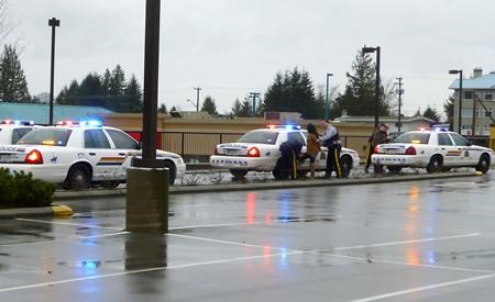 Police charge three for threatening pedestrian