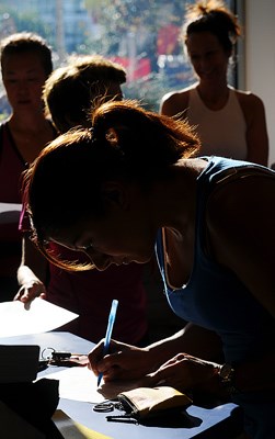 Forerunners hosts running clinics through the year. Neda Akabari signs up to participate at the North Vancouver sports store.