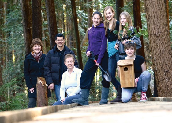 Eastview elementary principal Colleen Elderton (left), visits a new boardwalk built over a bog area behind the school as part of a stewardship project. Also on hand from the school: Jeremy Miller, Katherin Wallace, and students Hana Davis, Mieka Halliday-Gunn, Claire Kissinger and Brianna Wilson.