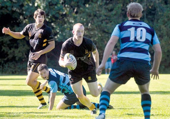 Capilano Rugby Club (black) in B.C Premier League action against Bayside in season opener at Klahanie Park.