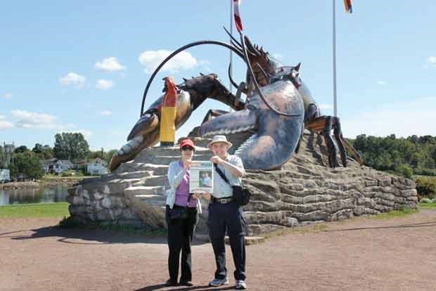 Betty Darch and Michael Gregory visit with a large lobster in Shediac, New Brunswick, self-descibed as the "Lobster capital of the world."