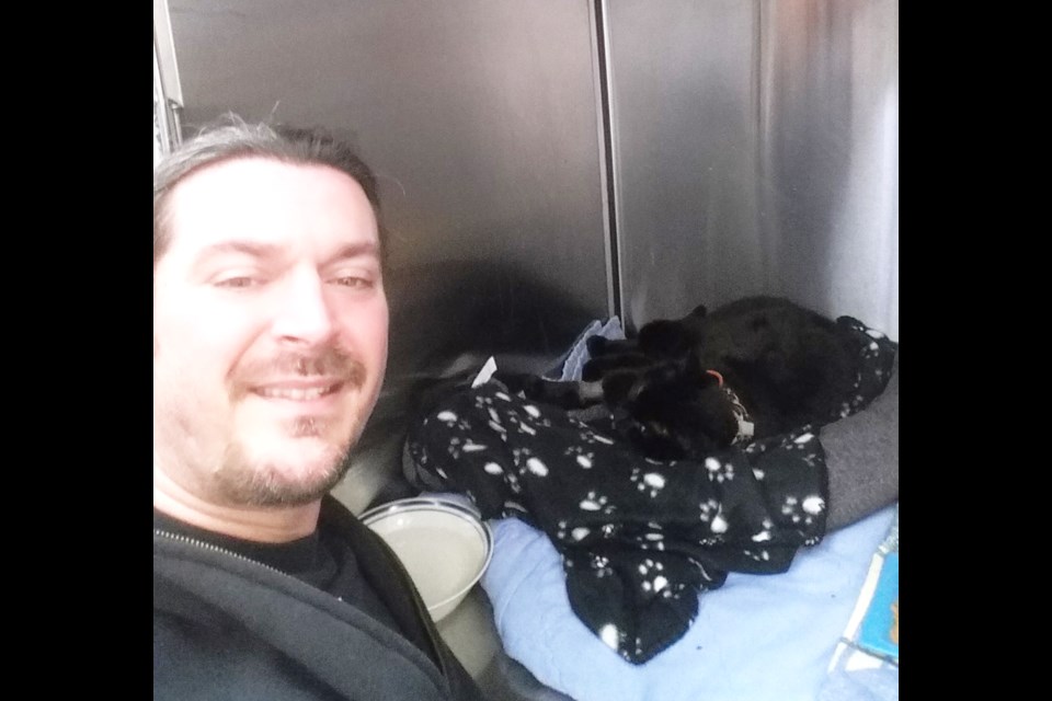 Dennis McDonald is adopting a black cat he found nearly dead on the side of the road.