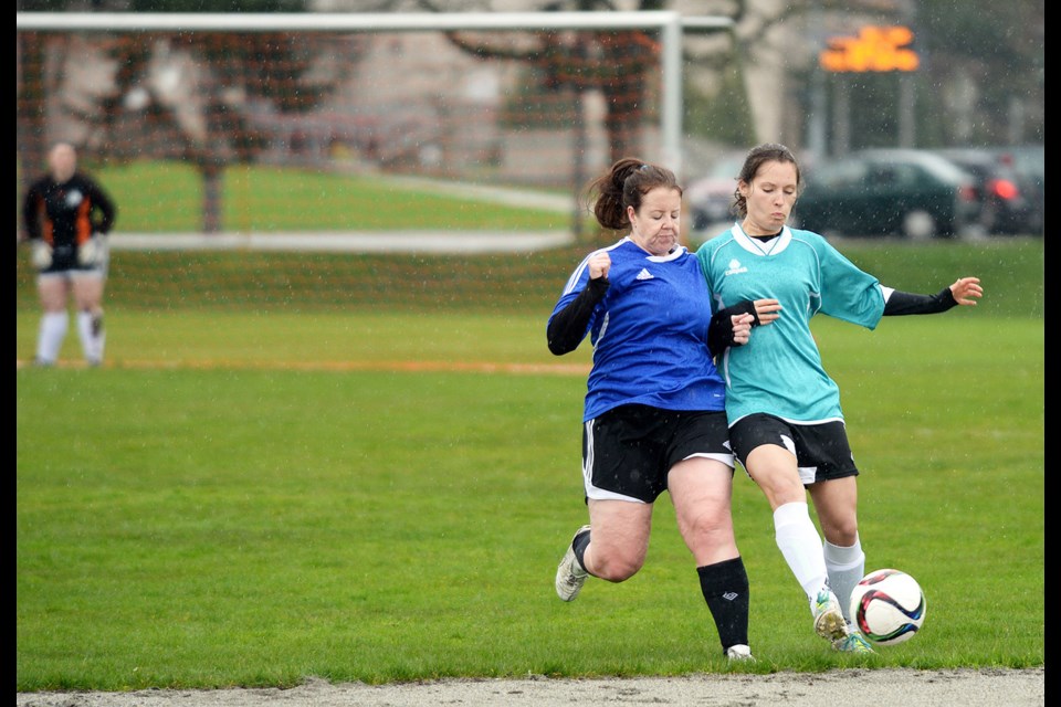 Sylvie Sherrin, in teal, defends the ball during the Royal City Kodiaks’ game against Delta United on Sunday.