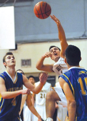 Argyle's no. 7 (white) John Neves goes for the basket against Handsworth.