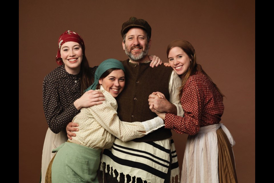 Warren Kimmel as Tevye with his daughters (from left) Natasha Zacher as Tzeitel, Julia Ullrich as Chava and Jenika Schofield as Hodel.