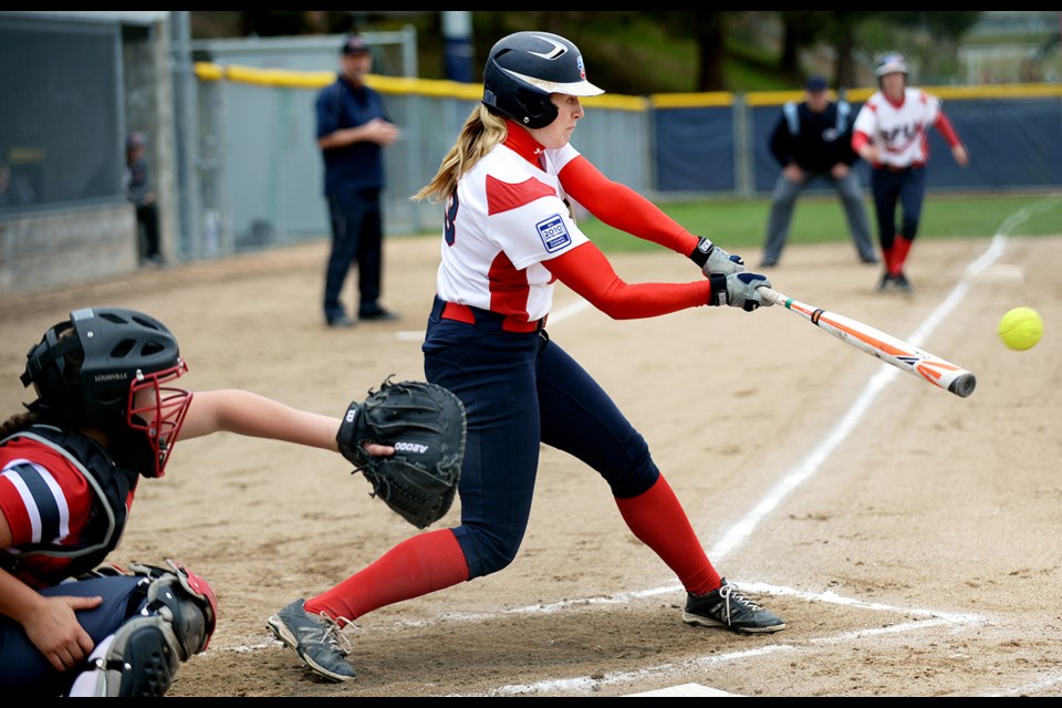 Rachel Proctor goes for the hit during SFU’s first game of a doubleheader against Western Oregon on Saturday.