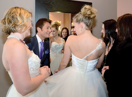 Sarah Groundwater and Aubrey Arnason, hosts of The Wedding Belles, vamp it up for American bridal expert Randy Fenoli at Isabelle's Bridal in North Vancouver.