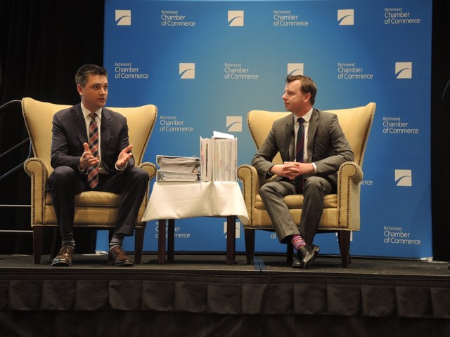 Todd Stone (left), B.C.’s transportation minister, spoke at the Sheraton on Wednesday in front of a mainly Richmond Chamber of Commerce member audience about the Massey Tunnel Replacement project. Here, he fields questions from the crowd, moderated by chamber chair Rob Akimow