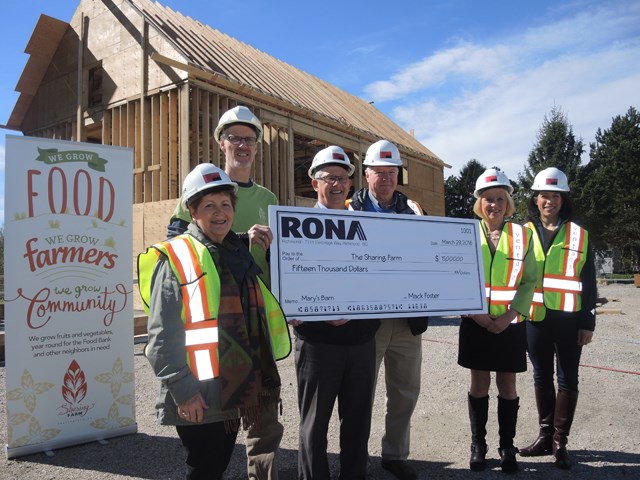 Alma (left) and Mack (fourth from left) Foster, owners of Rona on Elmbridge Way, donated $15,000 to get The Sharing Farm’s Mary’s Barn off the ground. They stand with James Gates (second from left), executive director of The Sharing Farm, and Couns. Bill McNulty, Carol Day and Alexa Loo.